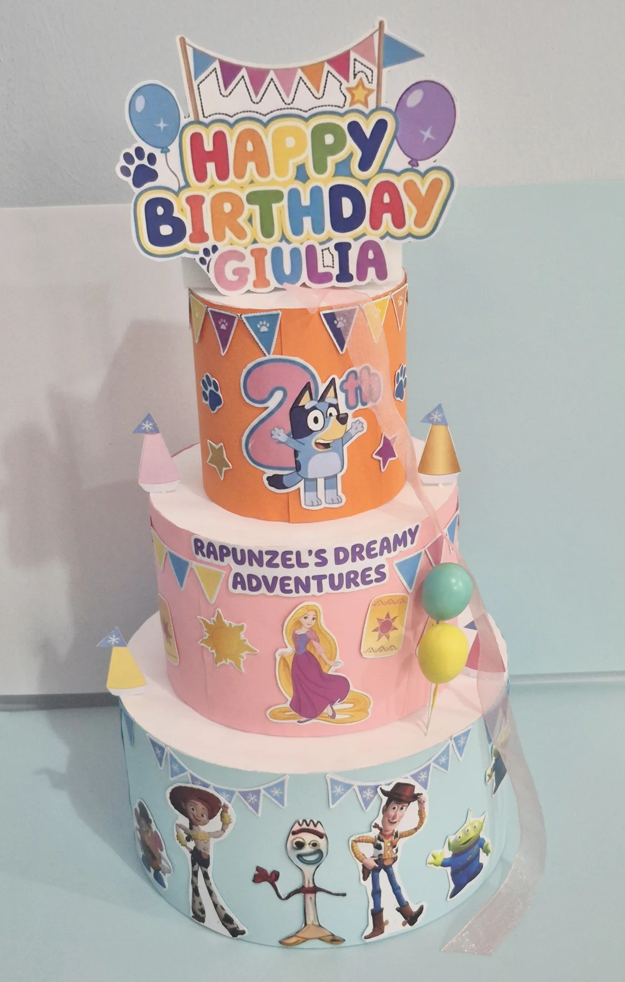 Torta scenografica tema Toy Story/Rapunzel/ Bluey